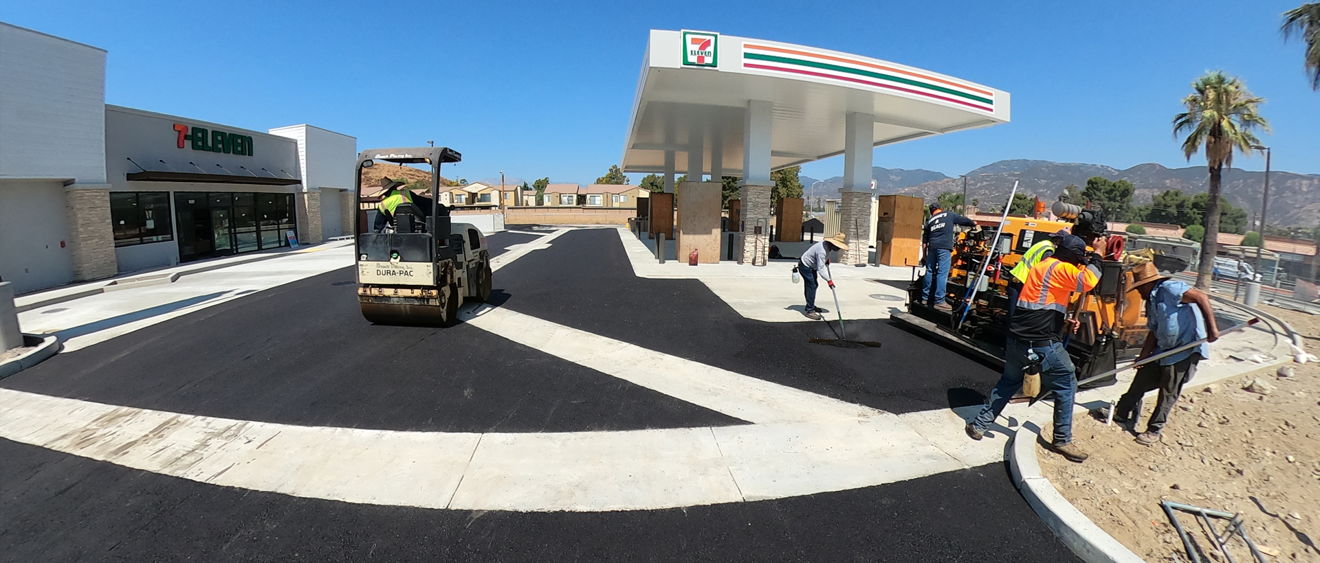 Fish Eye view of construstion team paving 7-eleven parking lot