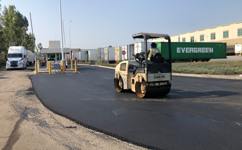 Solo worker driving construction vehicle