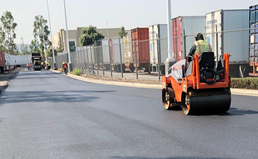 Solo worker driving small steam roller