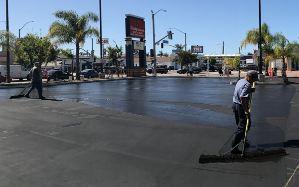 Construction Worker leveling new pavement